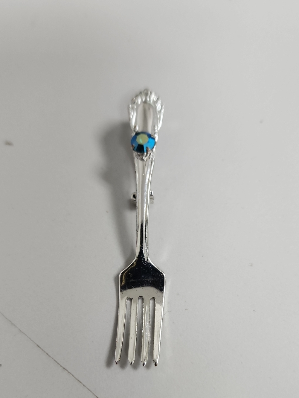 Silver Fork Brooch with Blue Crystal Accent